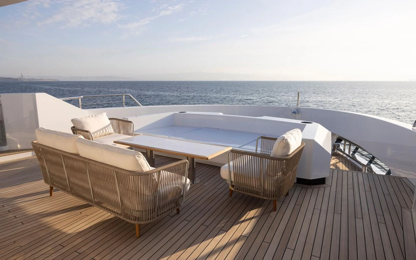 The aft deck offers a serene seating area with a stunning ocean view. aboard BEE EXPLORER YACHT Yacht for Sale