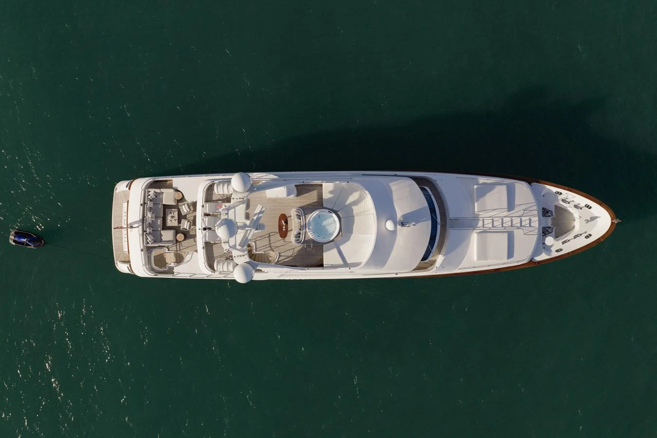 Aerial view of a luxurious yacht cruising on calm waters. aboard HOSHI Yacht for Sale
