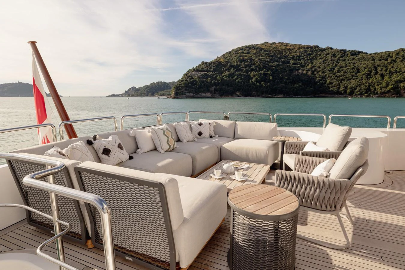 The aft deck features a spacious and comfortable seating area with a stunning view of the surrounding waters. aboard HOSHI Yacht for Sale