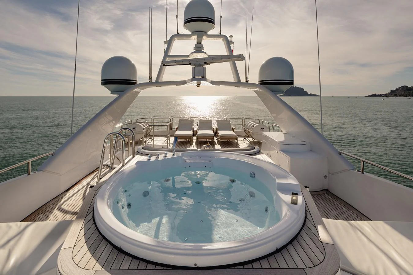 The sundeck features a luxurious jacuzzi with panoramic ocean views. aboard HOSHI Yacht for Sale