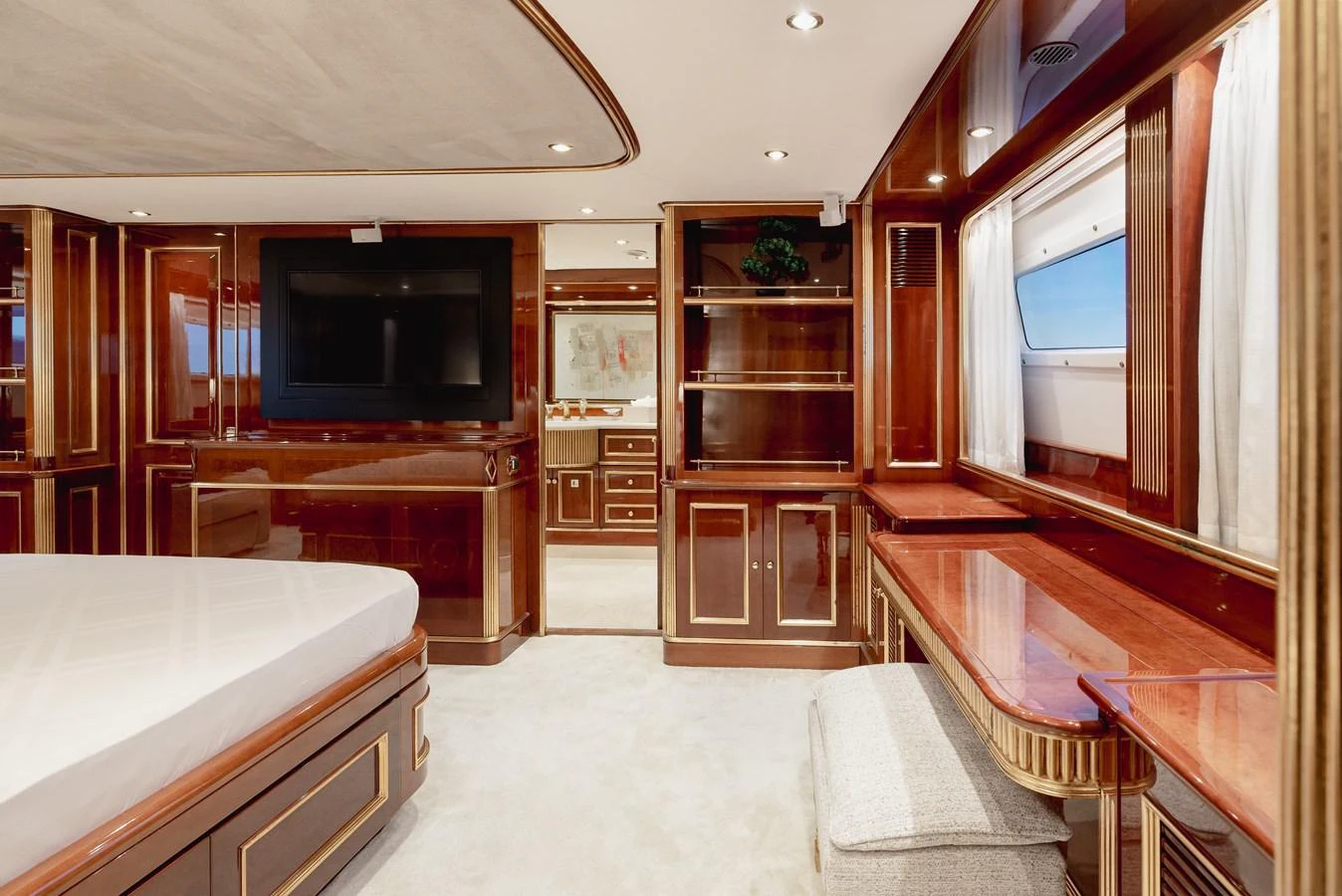 The master stateroom features luxurious wood finishes, a large bed, and ample storage space. aboard HOSHI Yacht for Sale