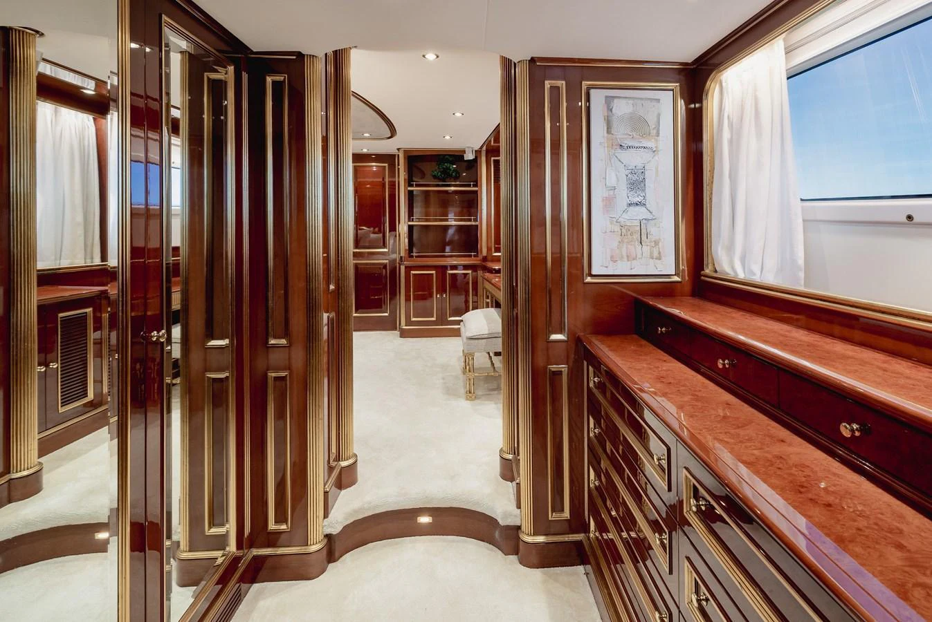 The yacht's interior features luxurious wood paneling and elegant cabinetry, creating a warm and sophisticated ambiance. aboard HOSHI Yacht for Sale