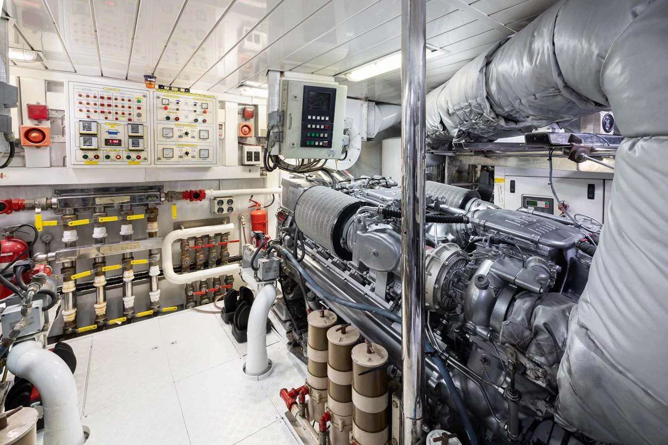 The image showcases the yacht's well-maintained engine room with advanced machinery and control panels. aboard HOSHI Yacht for Sale