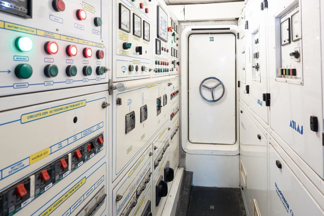 The image showcases the control panels and systems within the yacht's engine room. aboard HOSHI Yacht for Sale