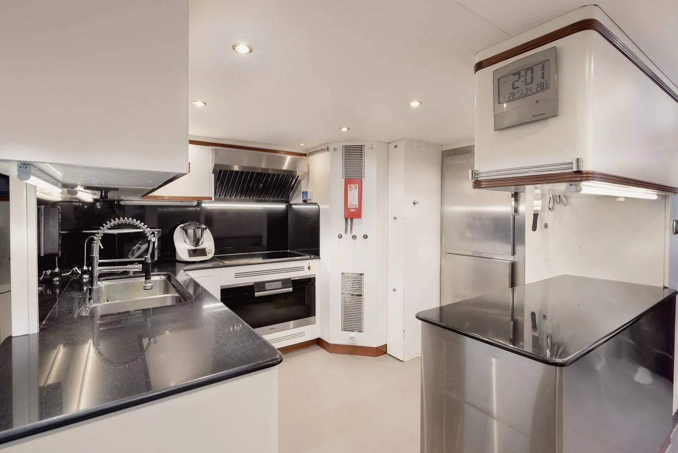The galley features modern appliances and sleek countertops, creating a functional and stylish space for meal preparation. aboard HOSHI Yacht for Sale