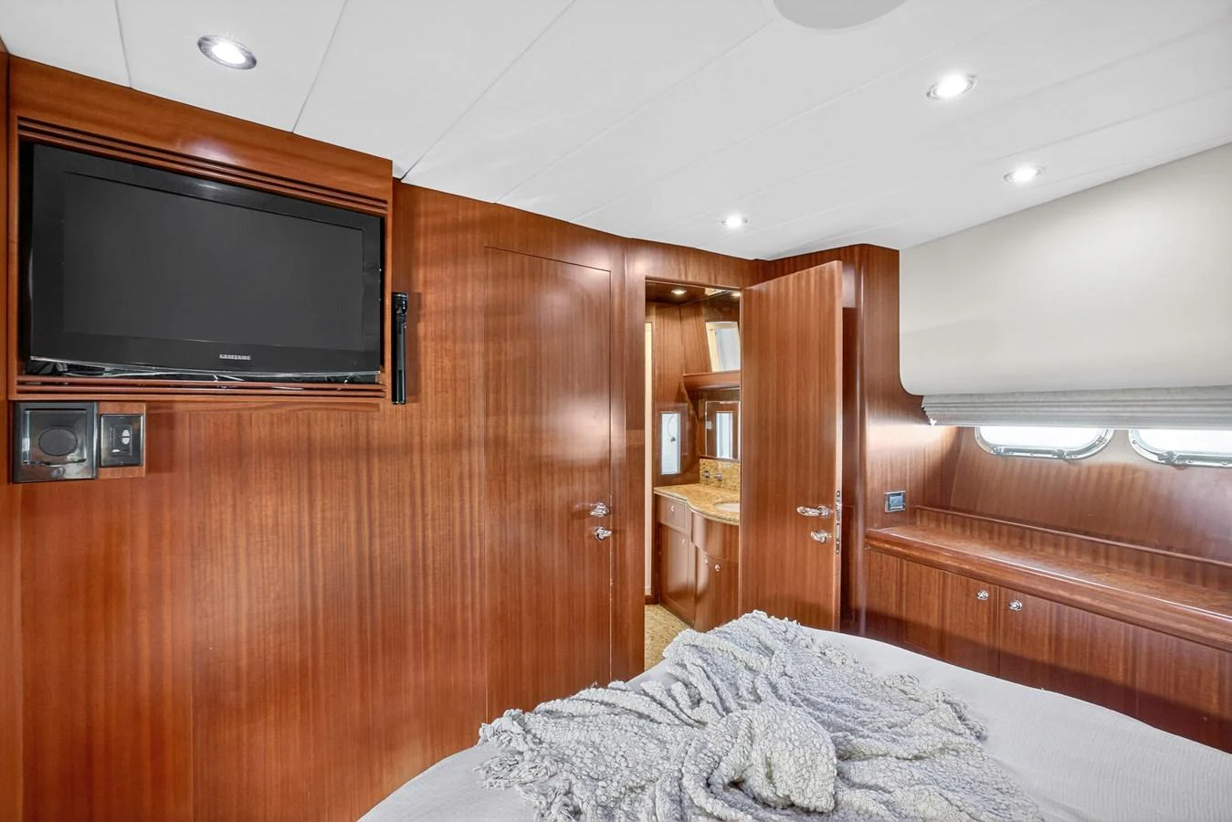 a bedroom with a tv and a bed aboard ARLENE Yacht for Sale