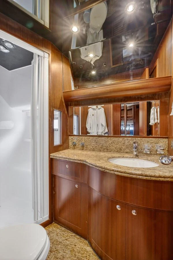 a bathroom with a sink and a mirror aboard ARLENE Yacht for Sale
