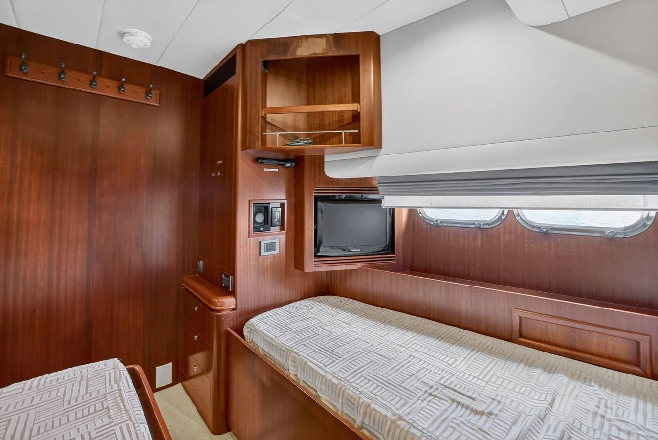 a room with a bed and a television aboard ARLENE Yacht for Sale