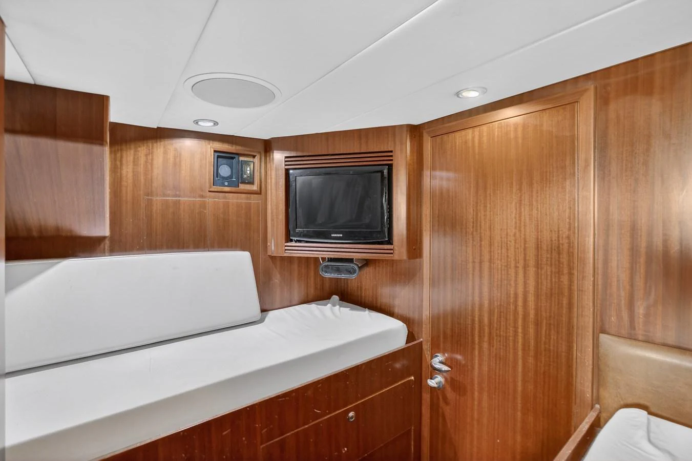 a room with a bed and a television aboard ARLENE Yacht for Sale