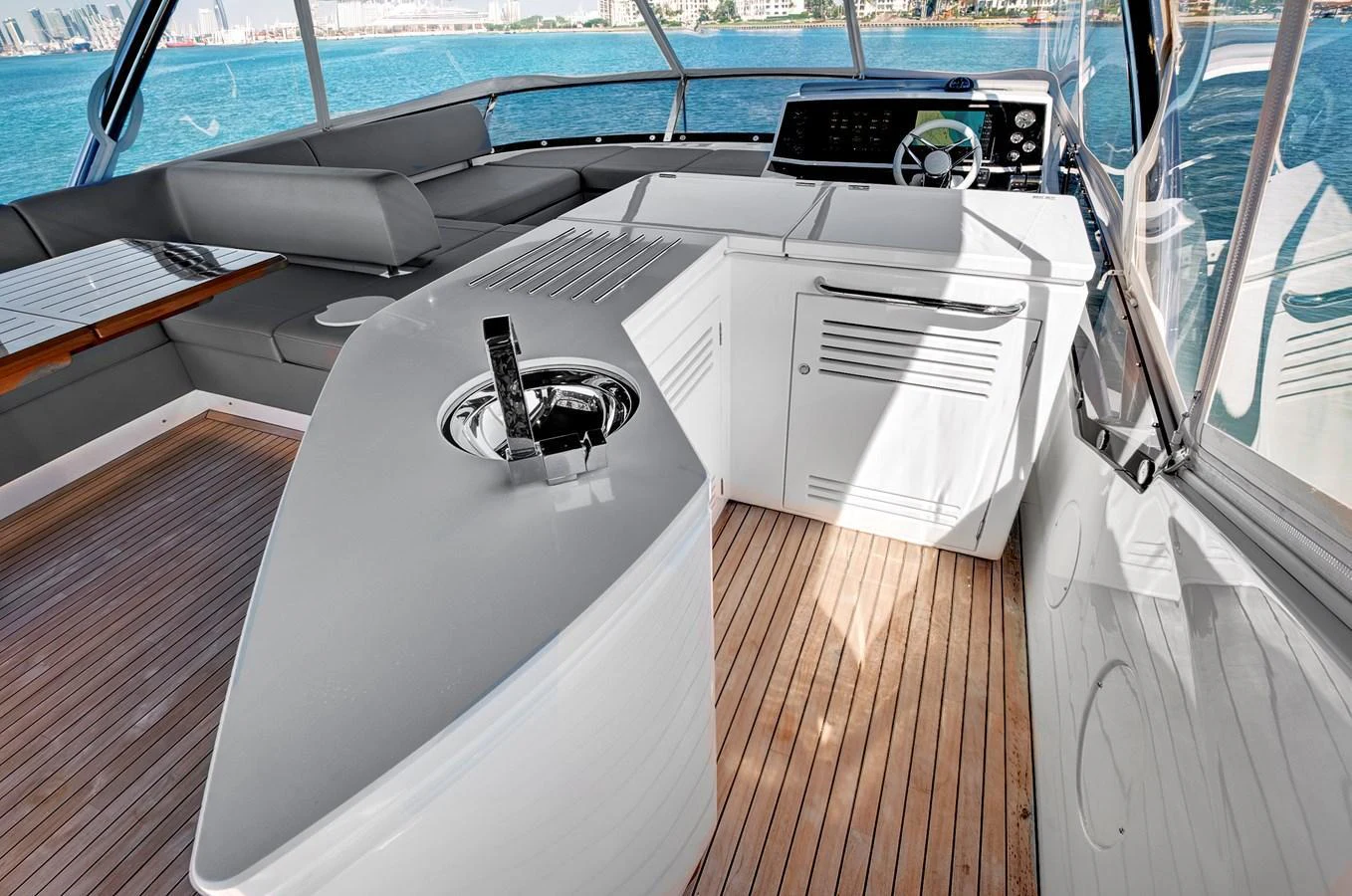 The helm area features modern controls and comfortable seating with a panoramic view. aboard MISTY K Yacht for Sale