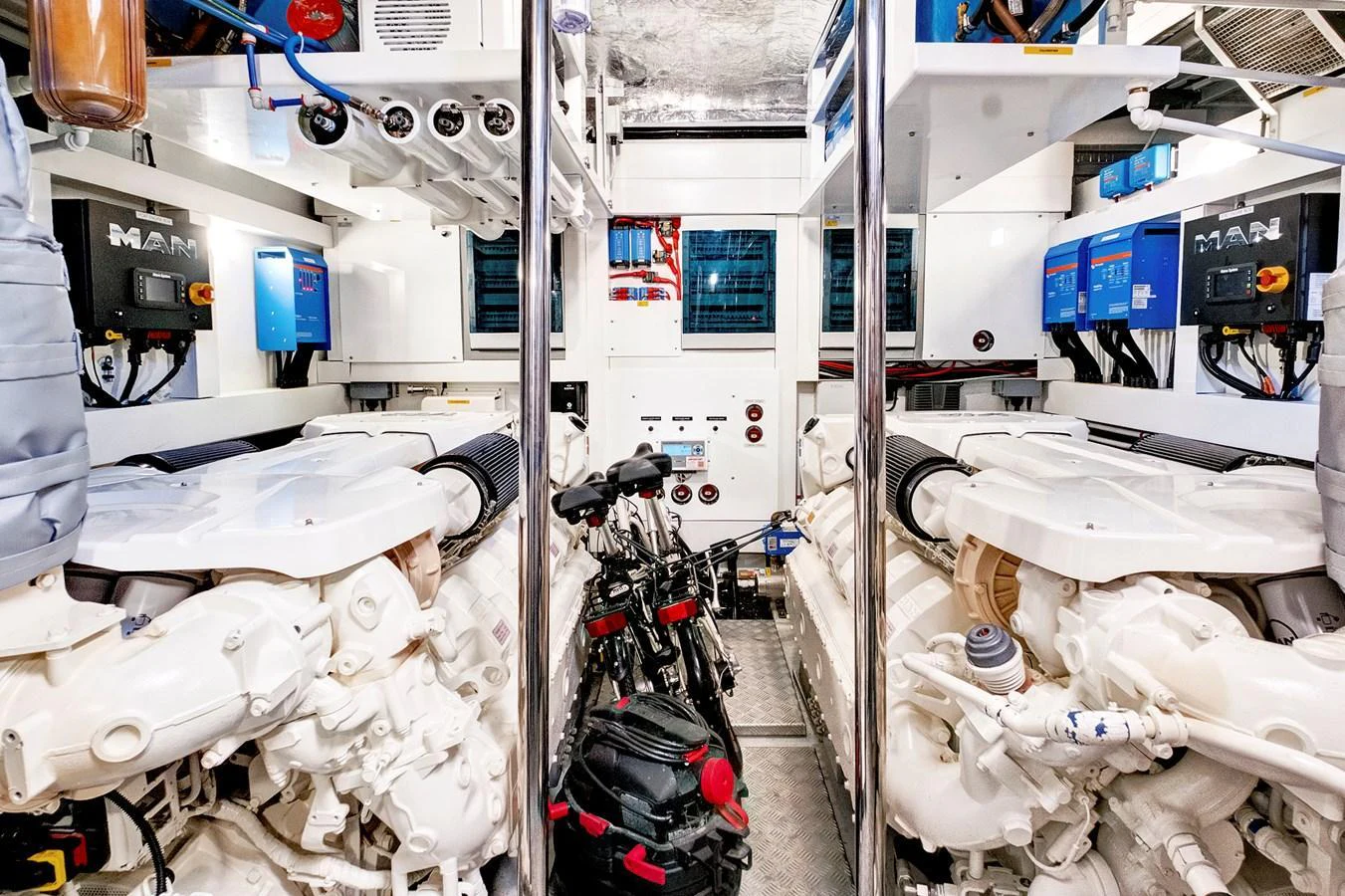 The image showcases the well-organized and pristine engine room of the yacht, highlighting its powerful machinery. aboard MISTY K Yacht for Sale