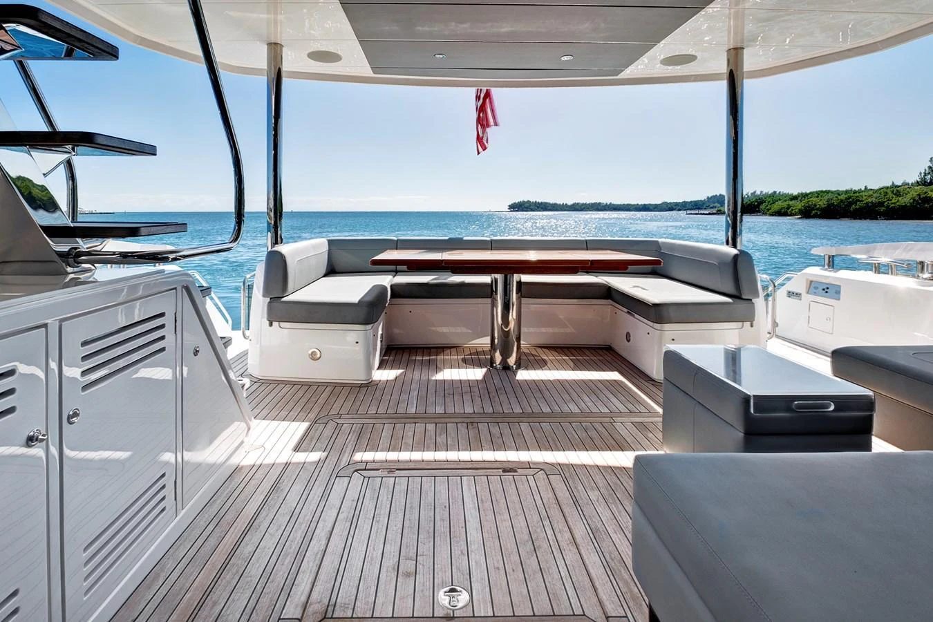 The aft deck offers a spacious and inviting area with comfortable seating and a stunning view of the water. aboard MISTY K Yacht for Sale