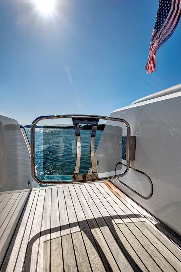 A close-up view of the yacht's boarding gate with a scenic water backdrop. aboard MISTY K Yacht for Sale