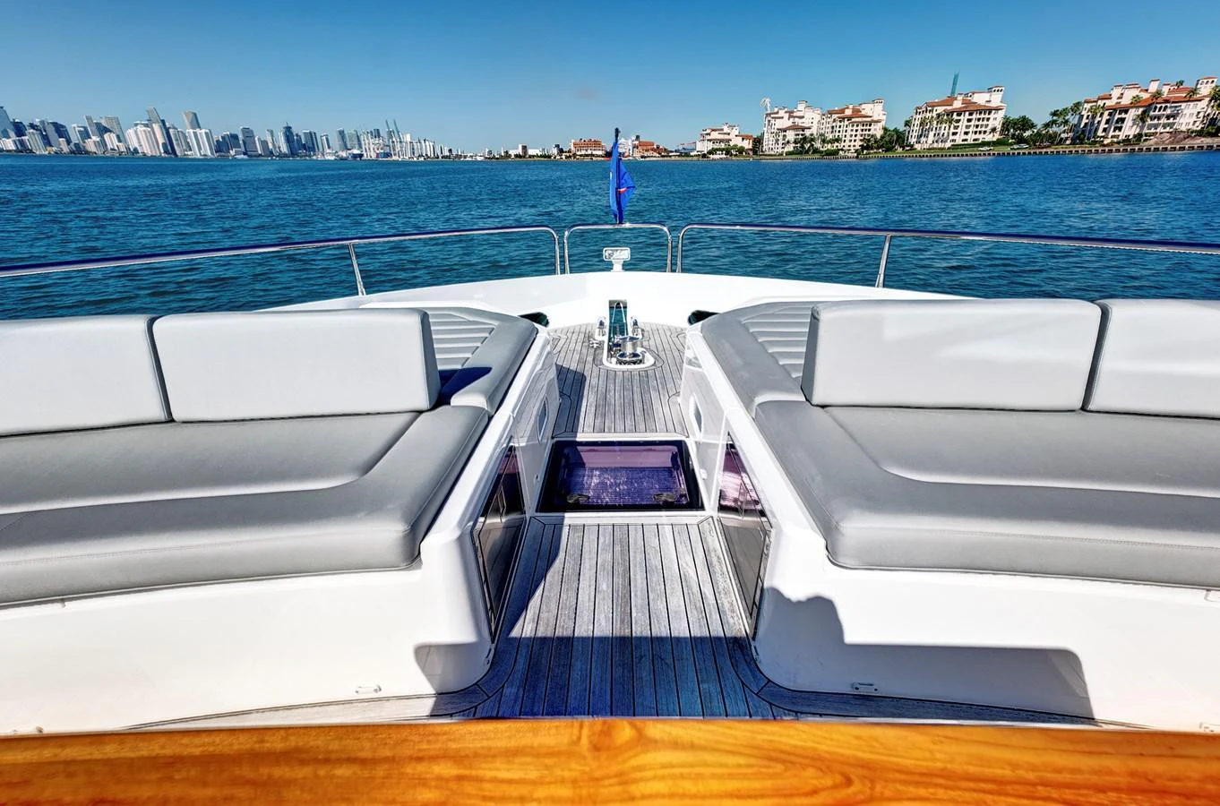 The bow of the yacht features spacious seating with a stunning view of the water and city skyline. aboard MISTY K Yacht for Sale