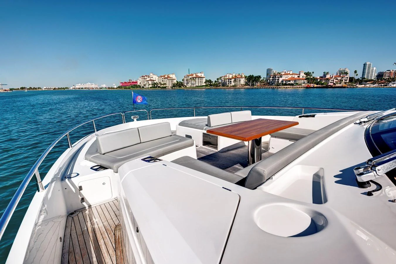 The foredeck features a spacious seating area with a table, perfect for enjoying the views. aboard MISTY K Yacht for Sale