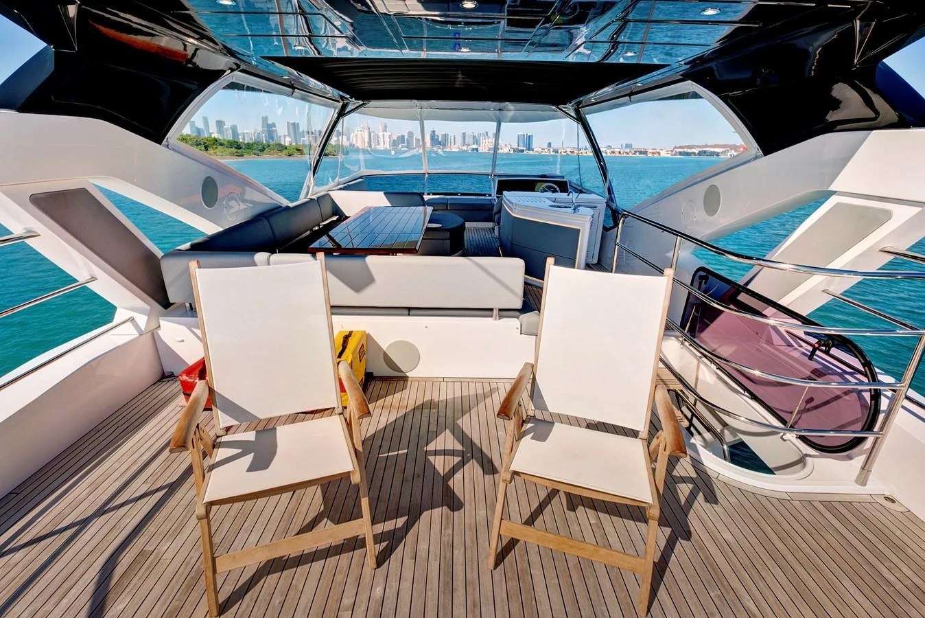 The aft deck offers a spacious and inviting area with comfortable seating and stunning views of the water. aboard MISTY K Yacht for Sale