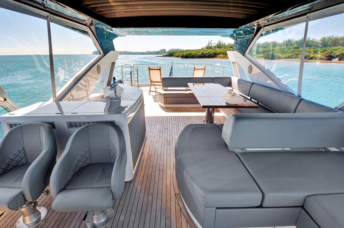 The flybridge offers a spacious and luxurious seating area with stunning ocean views. aboard MISTY K Yacht for Sale