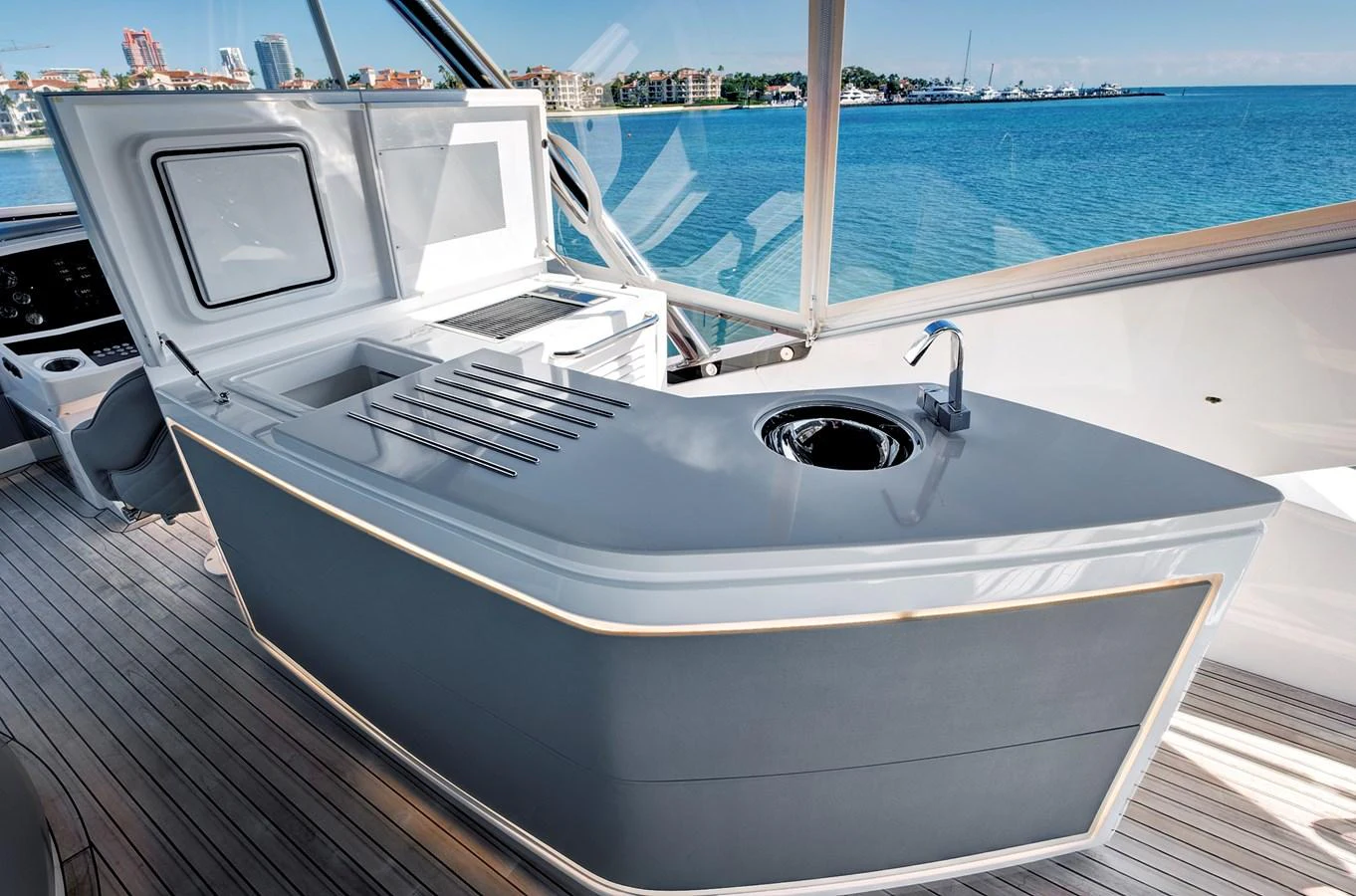 The yacht's galley features sleek, modern design with a view of the water. aboard MISTY K Yacht for Sale
