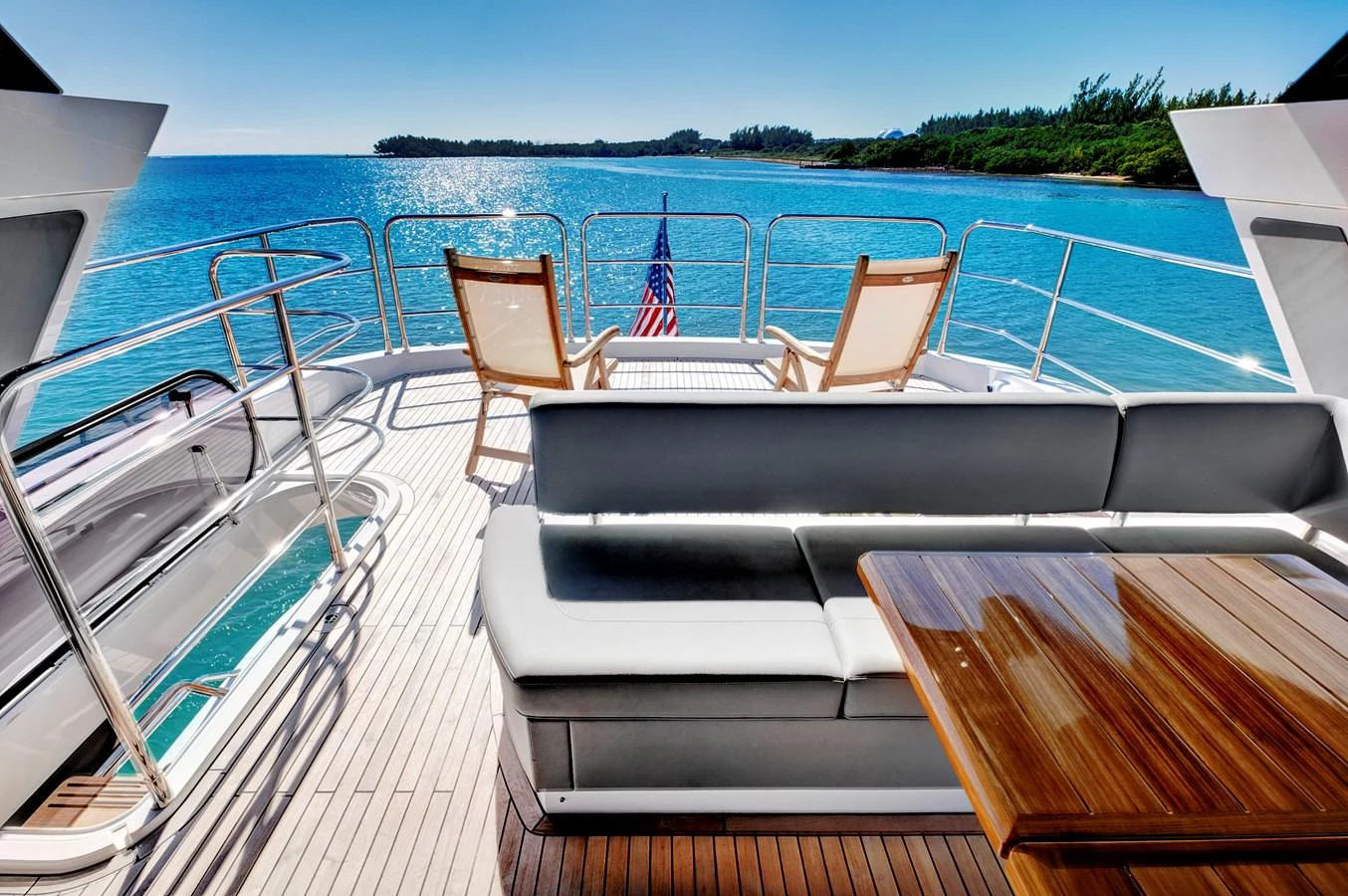 The aft deck offers a relaxing space with comfortable seating and stunning ocean views. aboard MISTY K Yacht for Sale