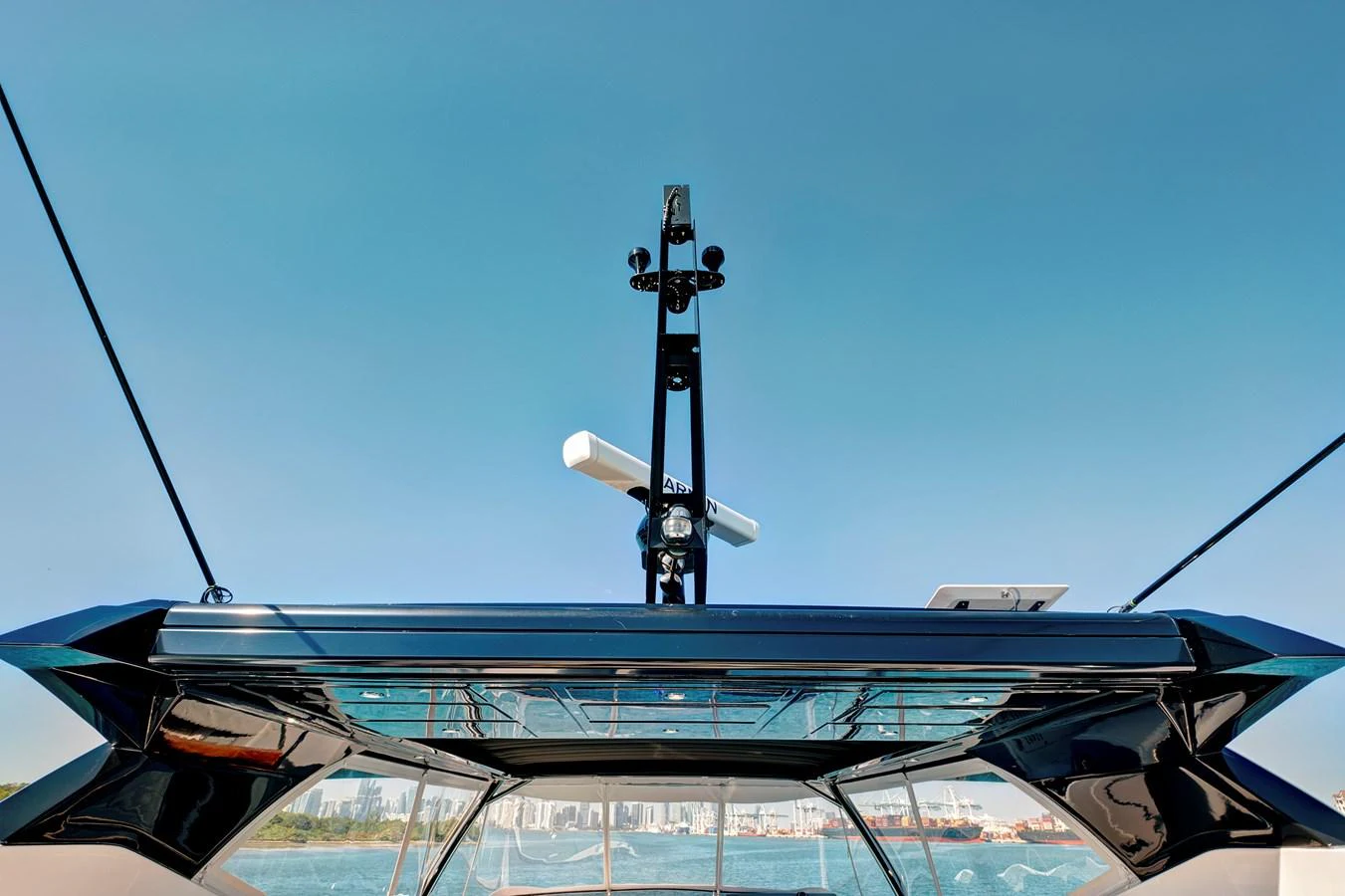 A close-up view of the yacht's radar and communication equipment against a clear blue sky. aboard MISTY K Yacht for Sale