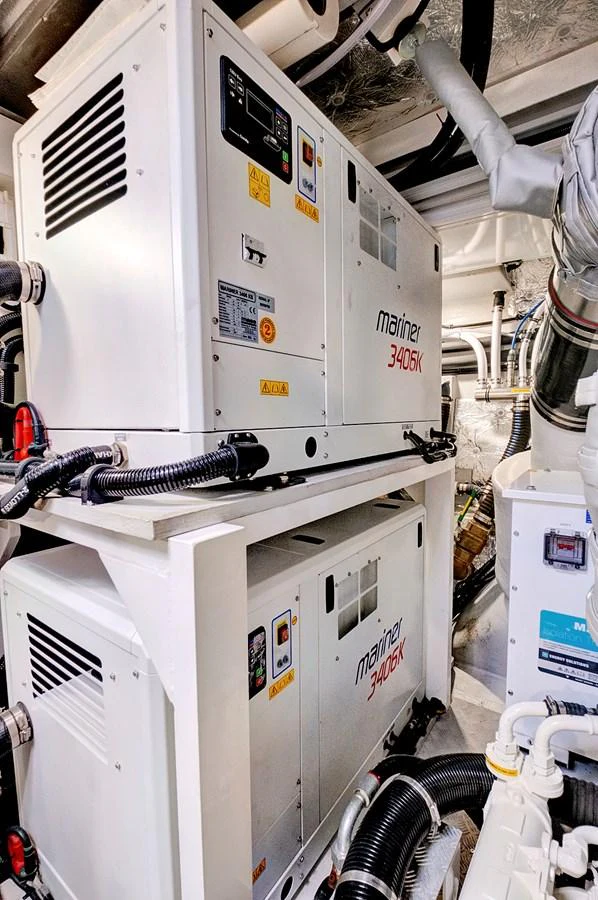 The image showcases the engine room with advanced machinery and equipment. aboard MISTY K Yacht for Sale
