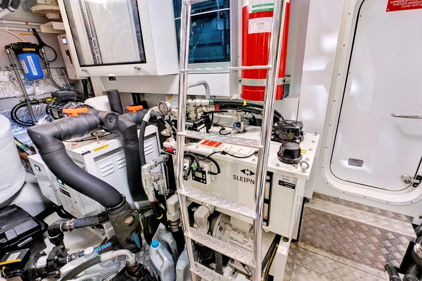The image showcases the yacht's well-maintained engine room with various mechanical components and equipment. aboard MISTY K Yacht for Sale