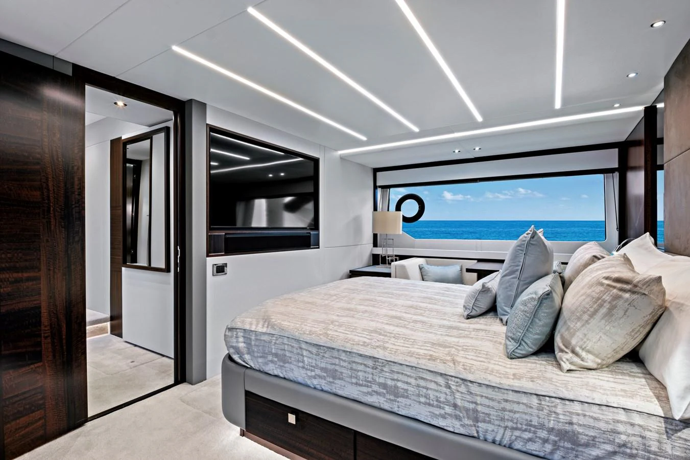 The master stateroom offers a luxurious retreat with panoramic ocean views and modern decor. aboard MISTY K Yacht for Sale
