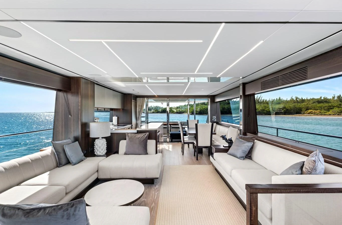 The salon offers a spacious and luxurious seating area with panoramic views of the sea. aboard MISTY K Yacht for Sale