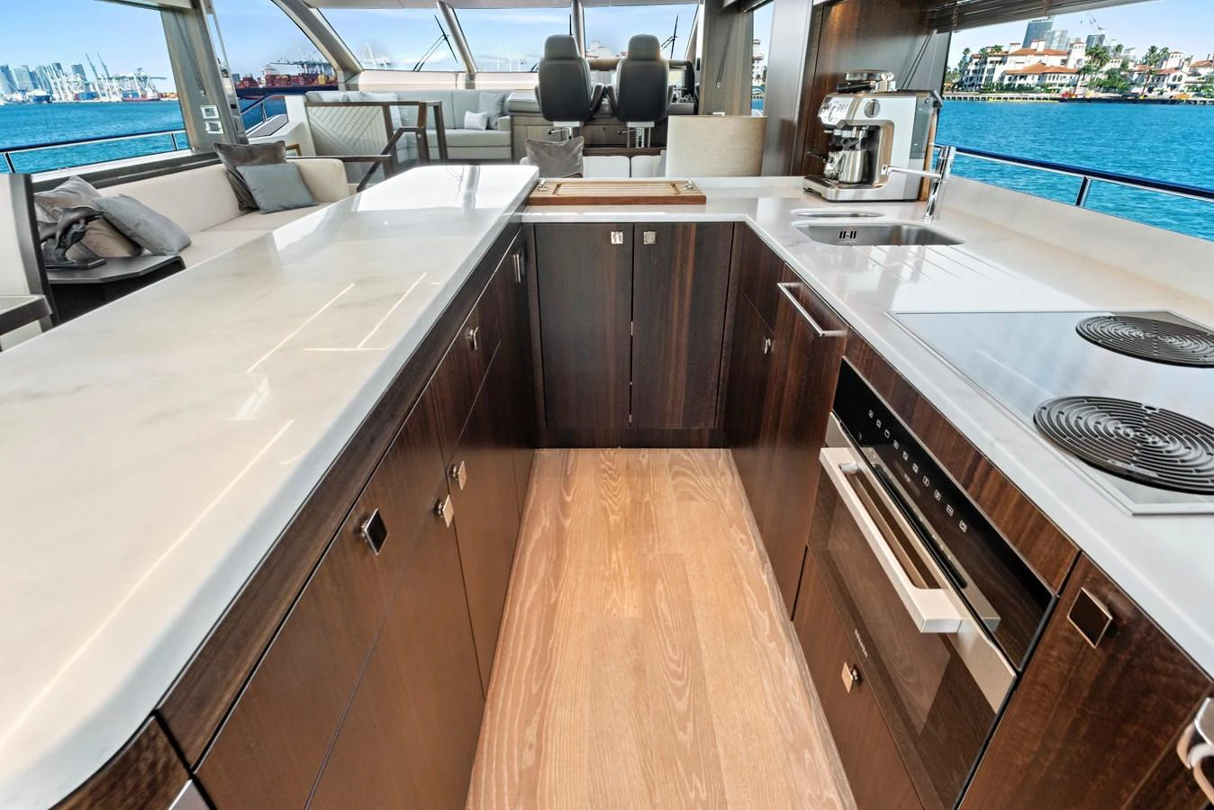 The galley features modern appliances and a sleek design with a view of the water. aboard MISTY K Yacht for Sale