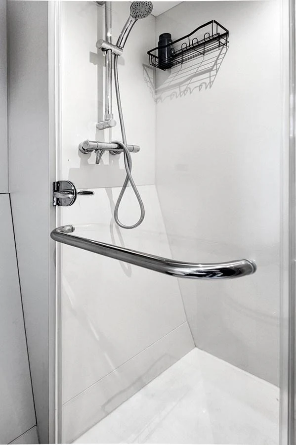 A sleek and modern yacht shower with minimalist fixtures and a clean design. aboard MISTY K Yacht for Sale