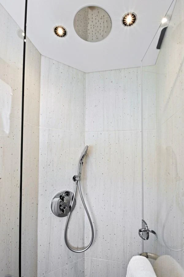 A sleek and modern yacht bathroom with a minimalist design. aboard MISTY K Yacht for Sale