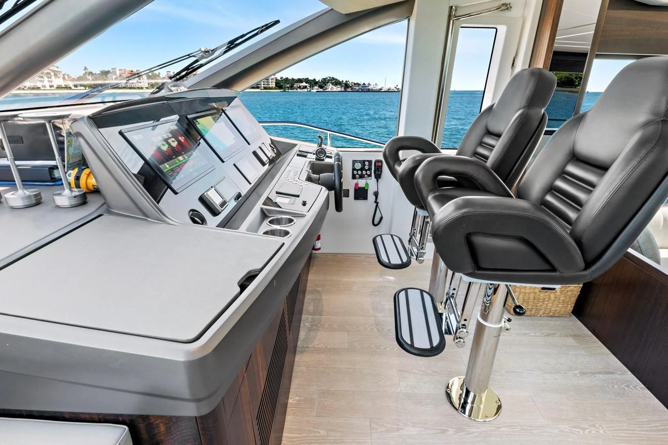 The helm station features modern navigation equipment and comfortable seating with a view of the water. aboard MISTY K Yacht for Sale
