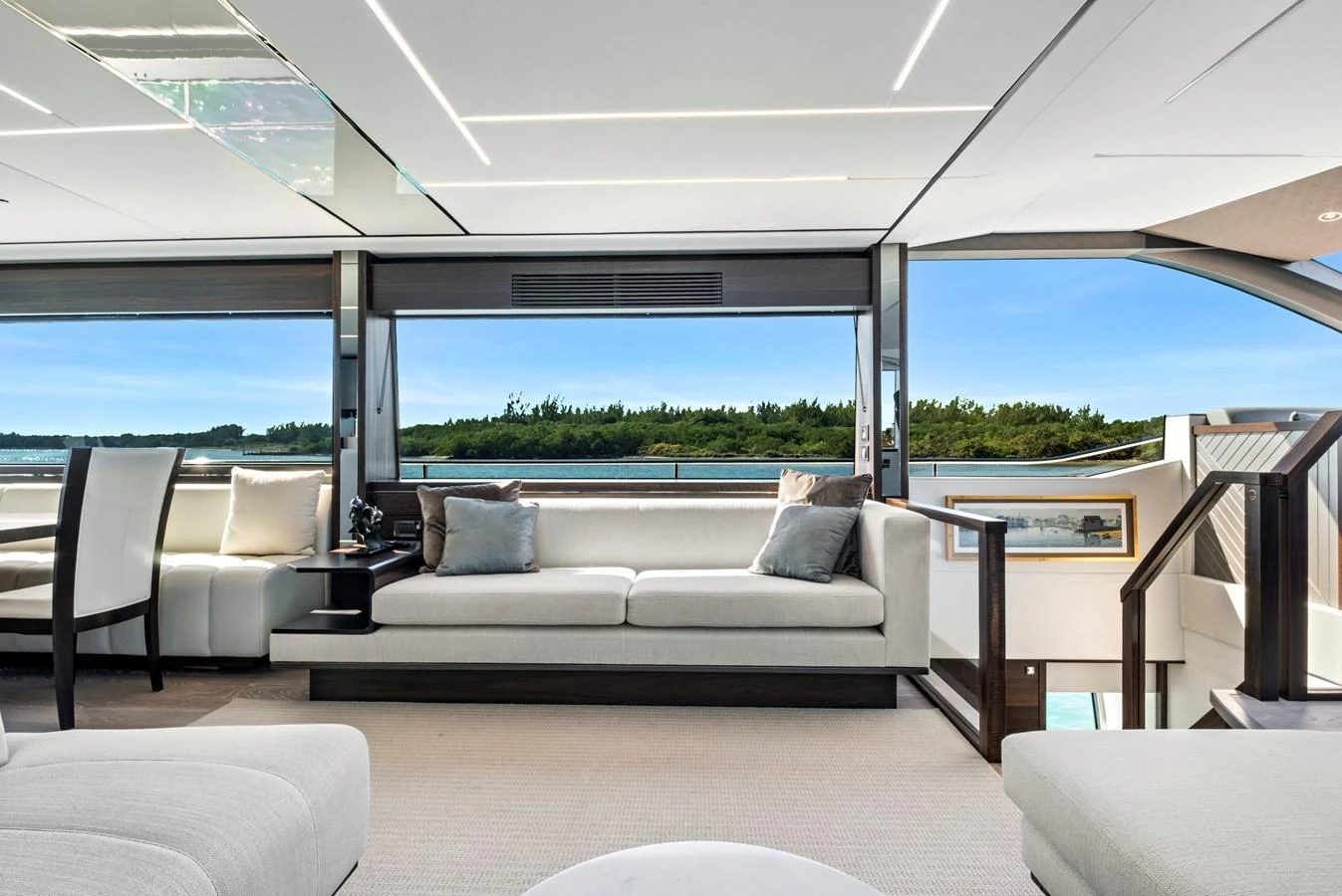 The salon offers a spacious and modern seating area with large windows providing stunning views. aboard MISTY K Yacht for Sale