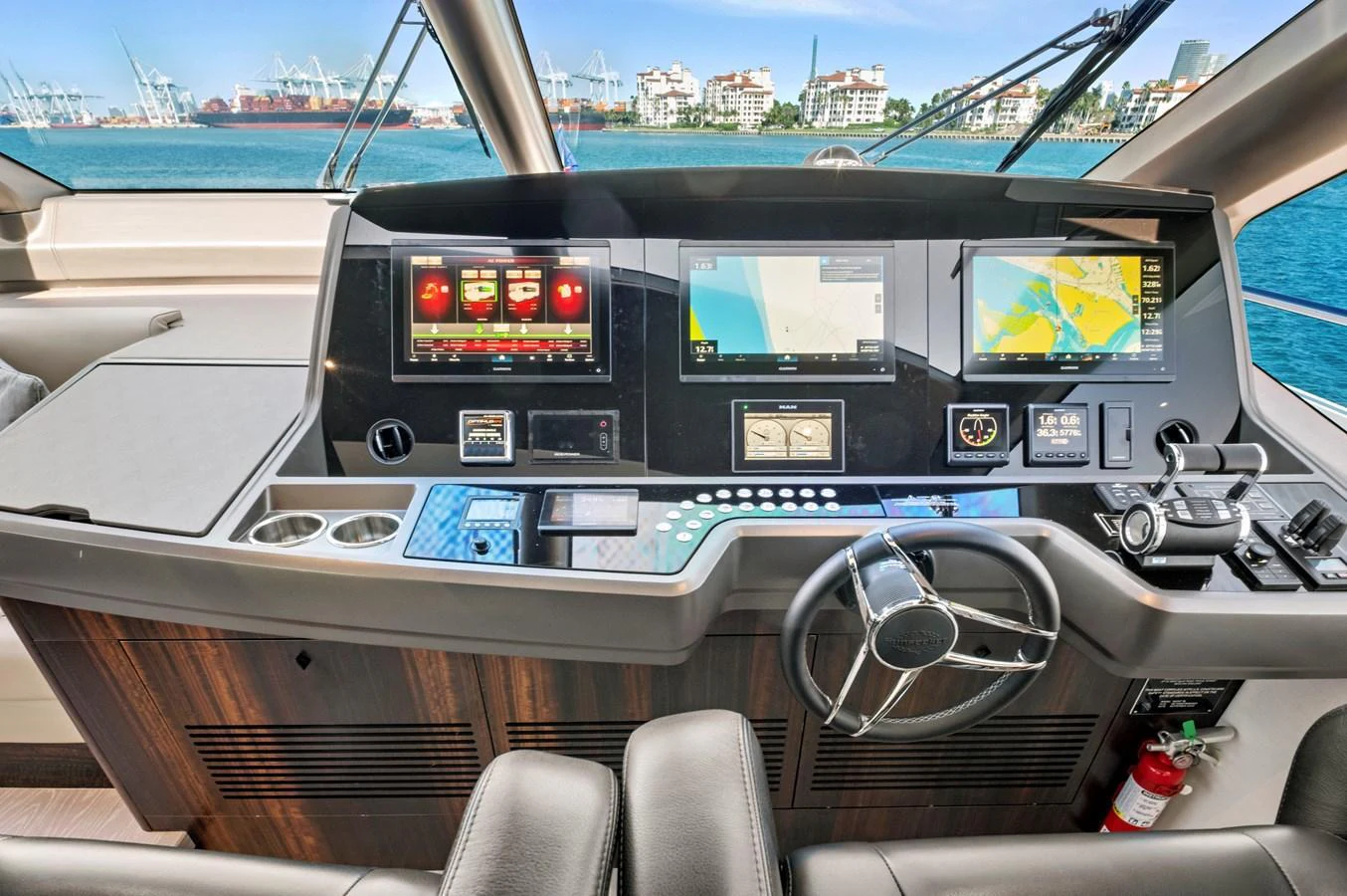 The helm station features advanced navigation systems and luxurious finishes, offering a commanding view of the surroundings. aboard MISTY K Yacht for Sale