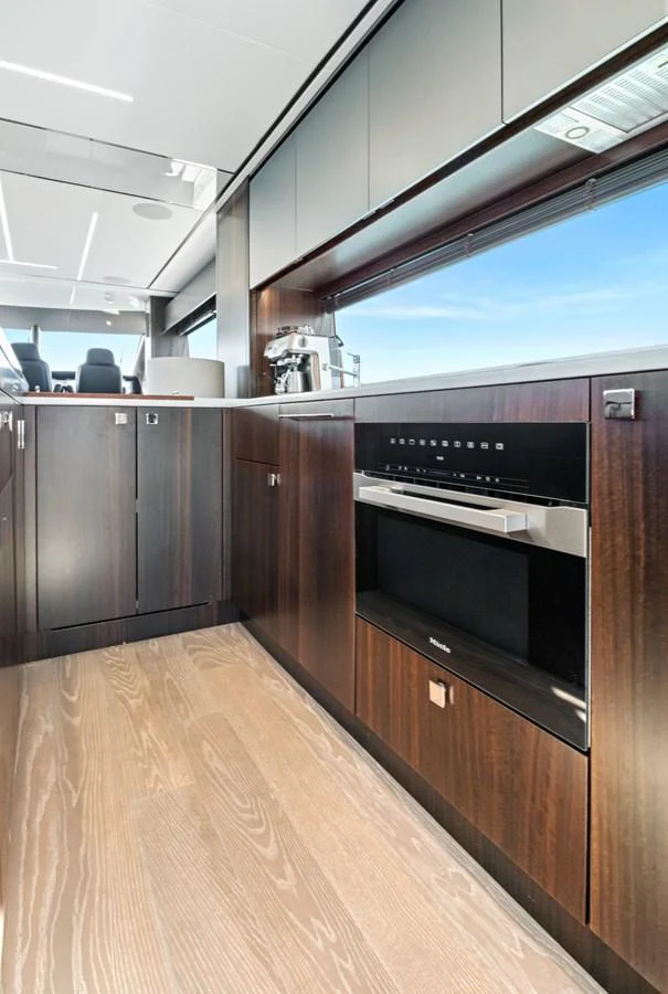 The modern galley features sleek cabinetry and state-of-the-art appliances. aboard MISTY K Yacht for Sale
