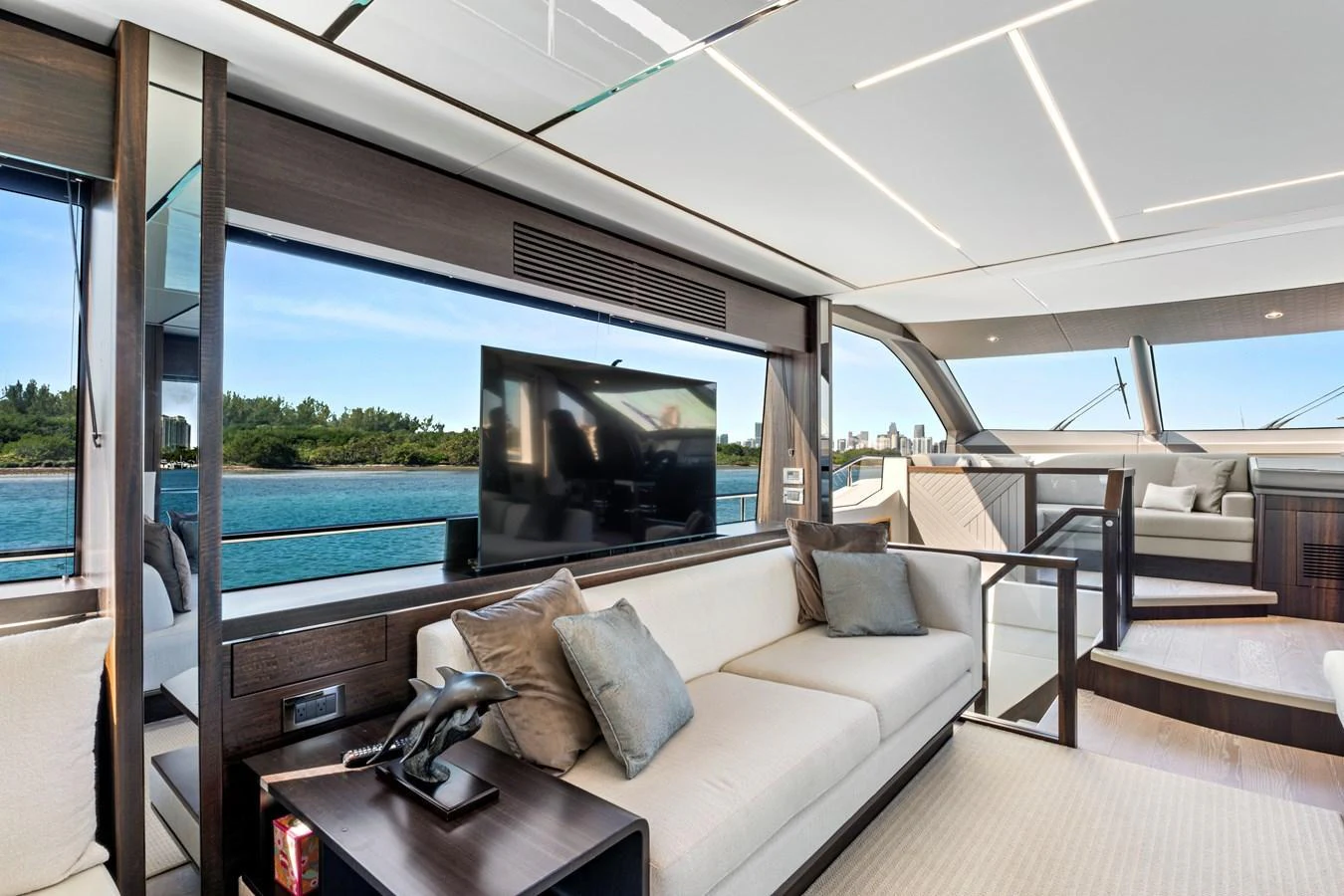The salon features modern furnishings with large windows offering stunning water views. aboard MISTY K Yacht for Sale