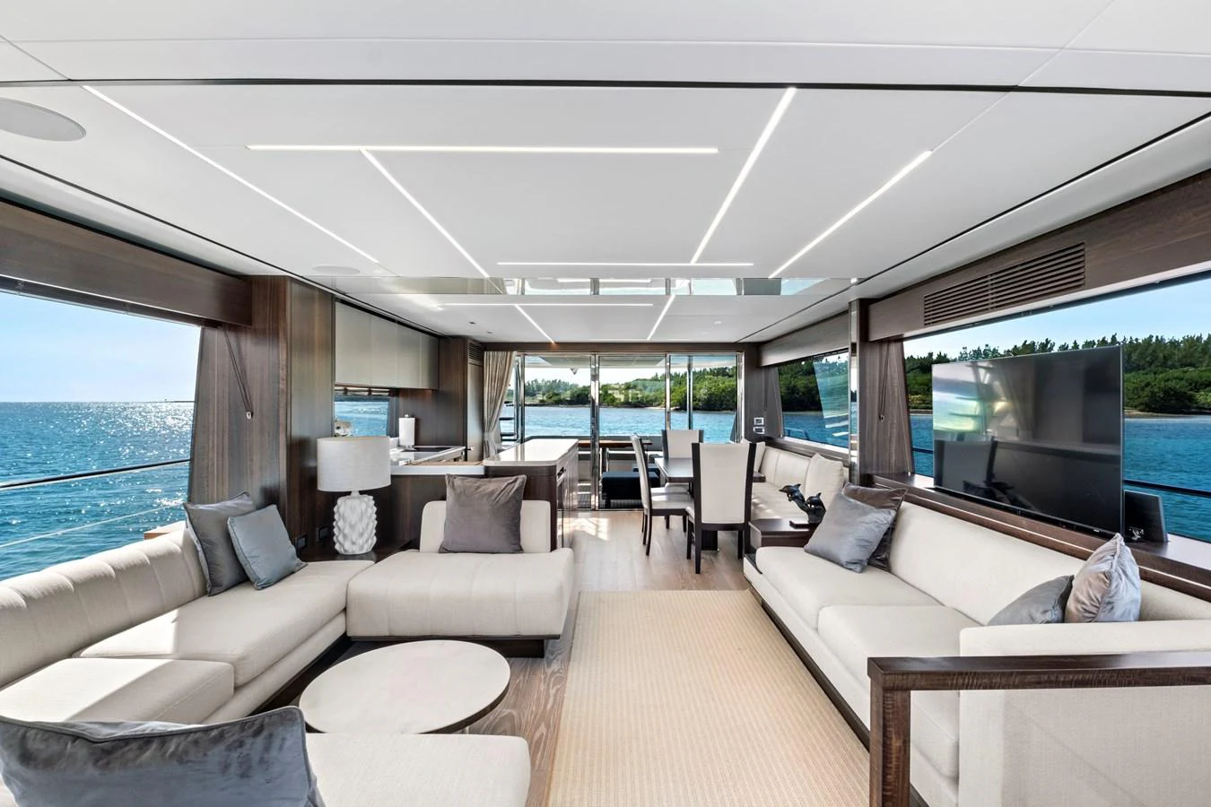 The salon offers a spacious and luxurious seating area with panoramic views of the sea. aboard MISTY K Yacht for Sale