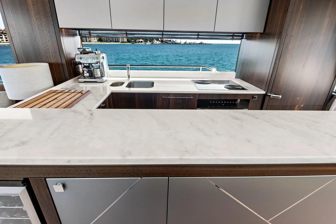 The yacht's galley features a sleek, modern design with a stunning ocean view. aboard MISTY K Yacht for Sale