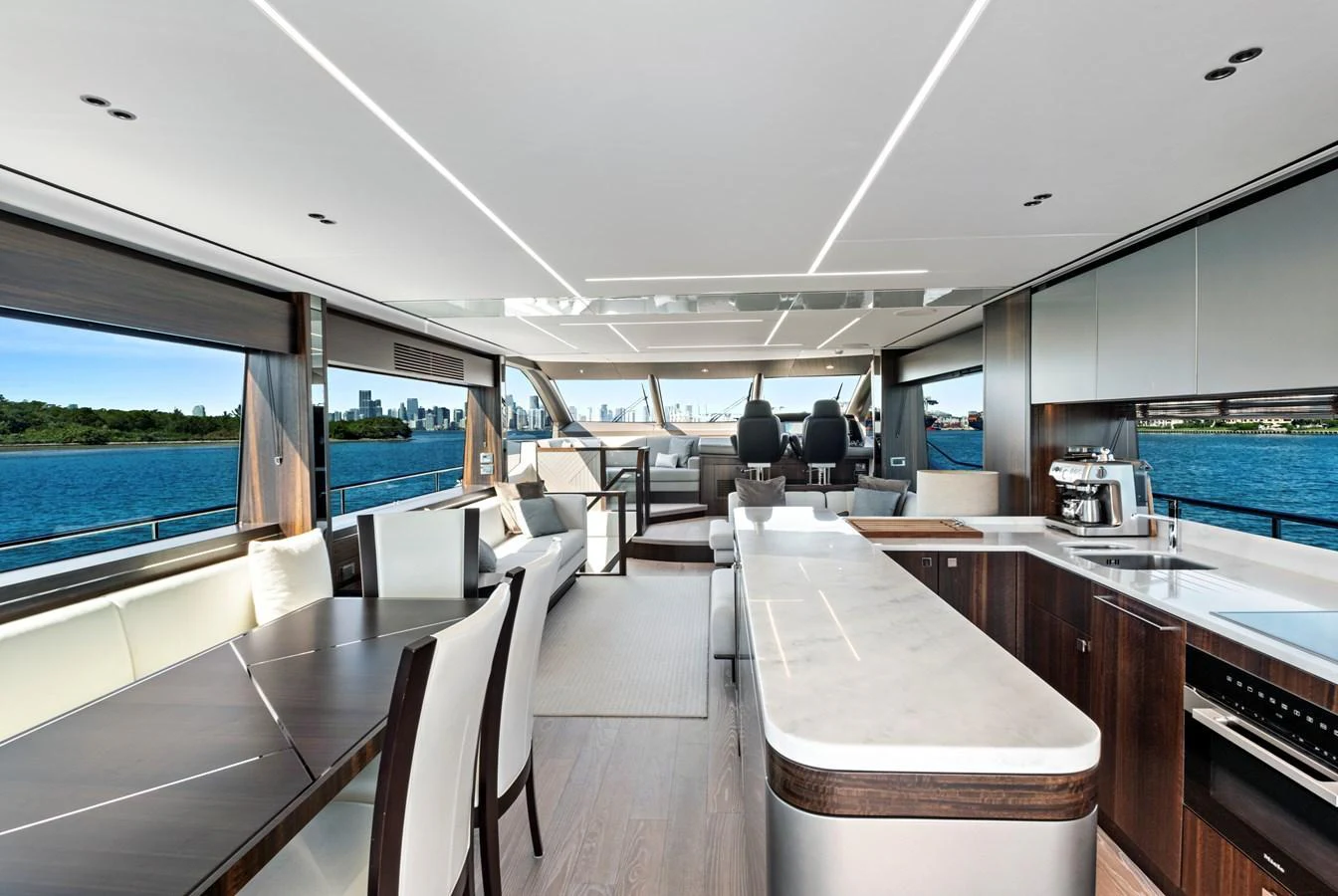 The salon features a spacious and modern design with panoramic windows offering stunning views. aboard MISTY K Yacht for Sale