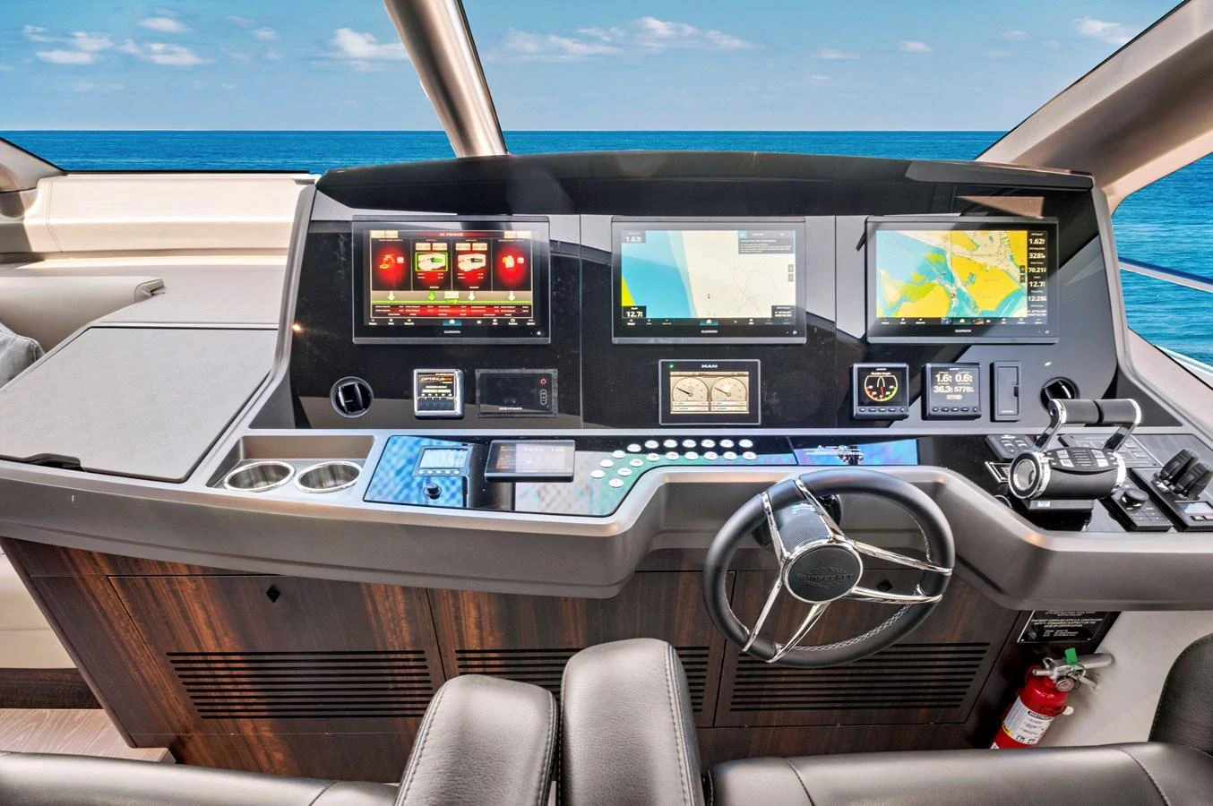 The helm station features advanced navigation equipment and a sleek, modern design. aboard MISTY K Yacht for Sale