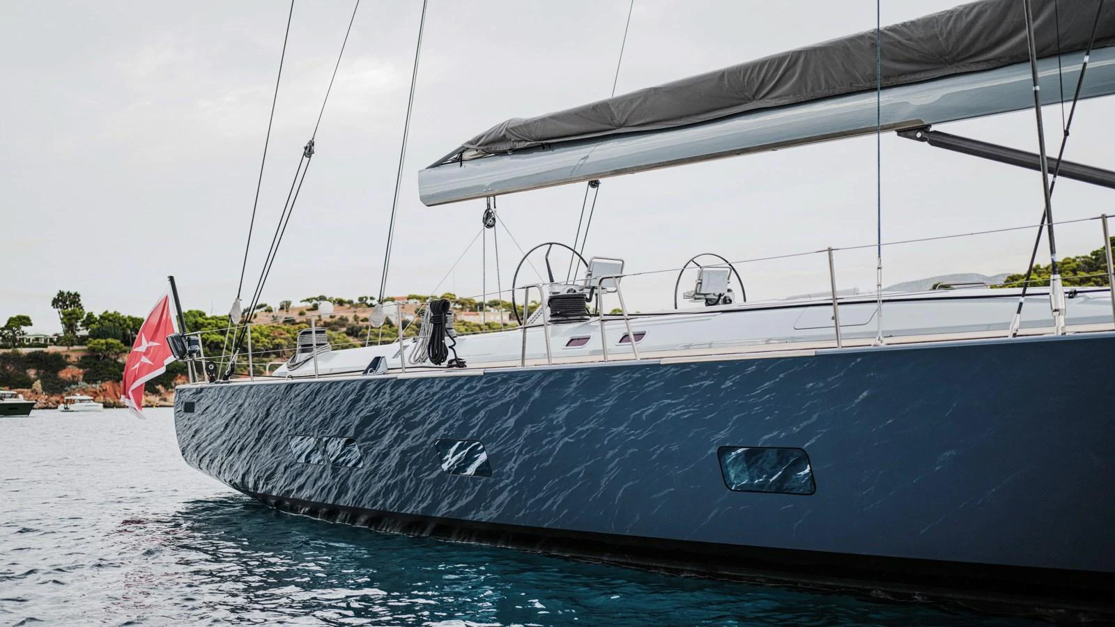 A sleek sailing yacht with a modern design glides gracefully on the water. aboard AUGUSTA WALLY Yacht for Sale