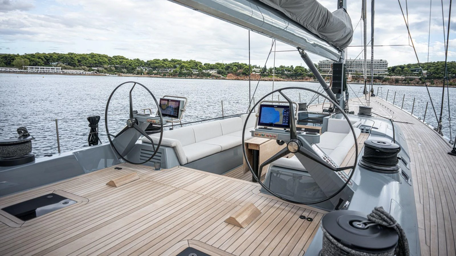 The yacht's helm area features dual steering wheels and advanced navigation equipment, offering a sleek and modern design. aboard AUGUSTA WALLY Yacht for Sale