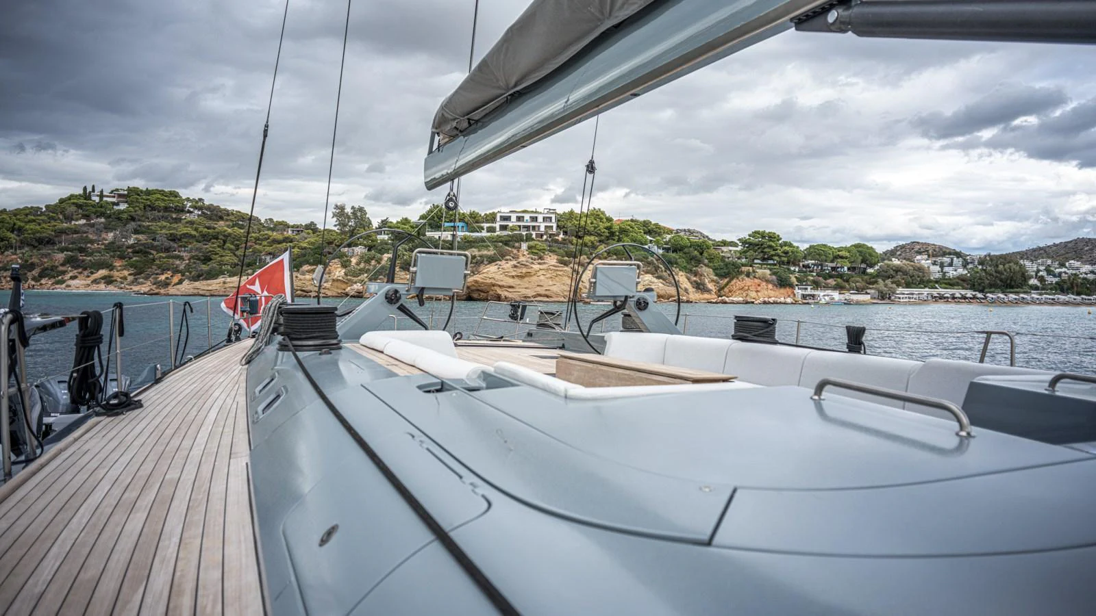 A sleek yacht deck with modern design elements and scenic coastal views. aboard AUGUSTA WALLY Yacht for Sale