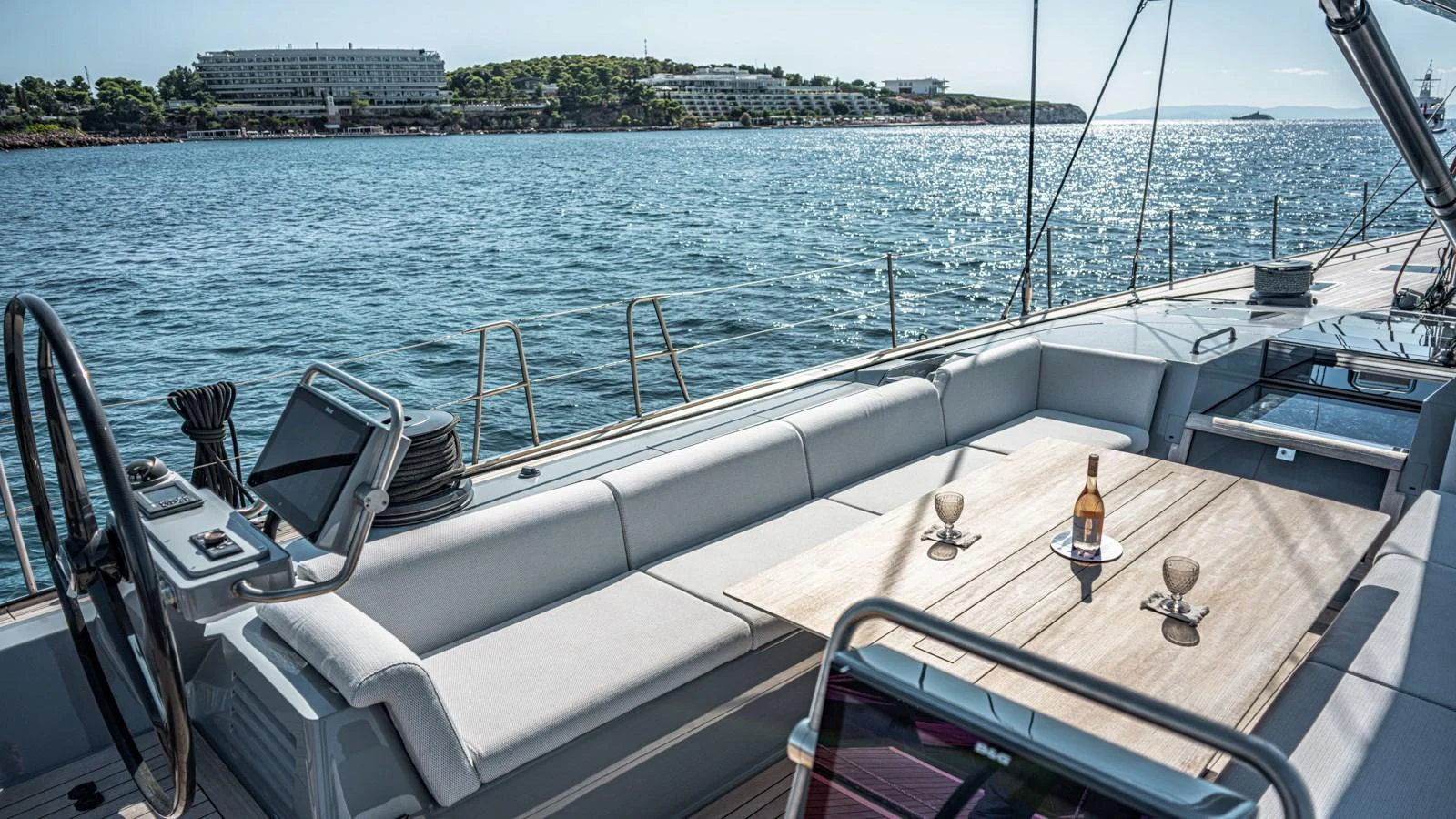 The aft deck features a spacious seating area with a table, perfect for enjoying drinks while cruising. aboard AUGUSTA WALLY Yacht for Sale