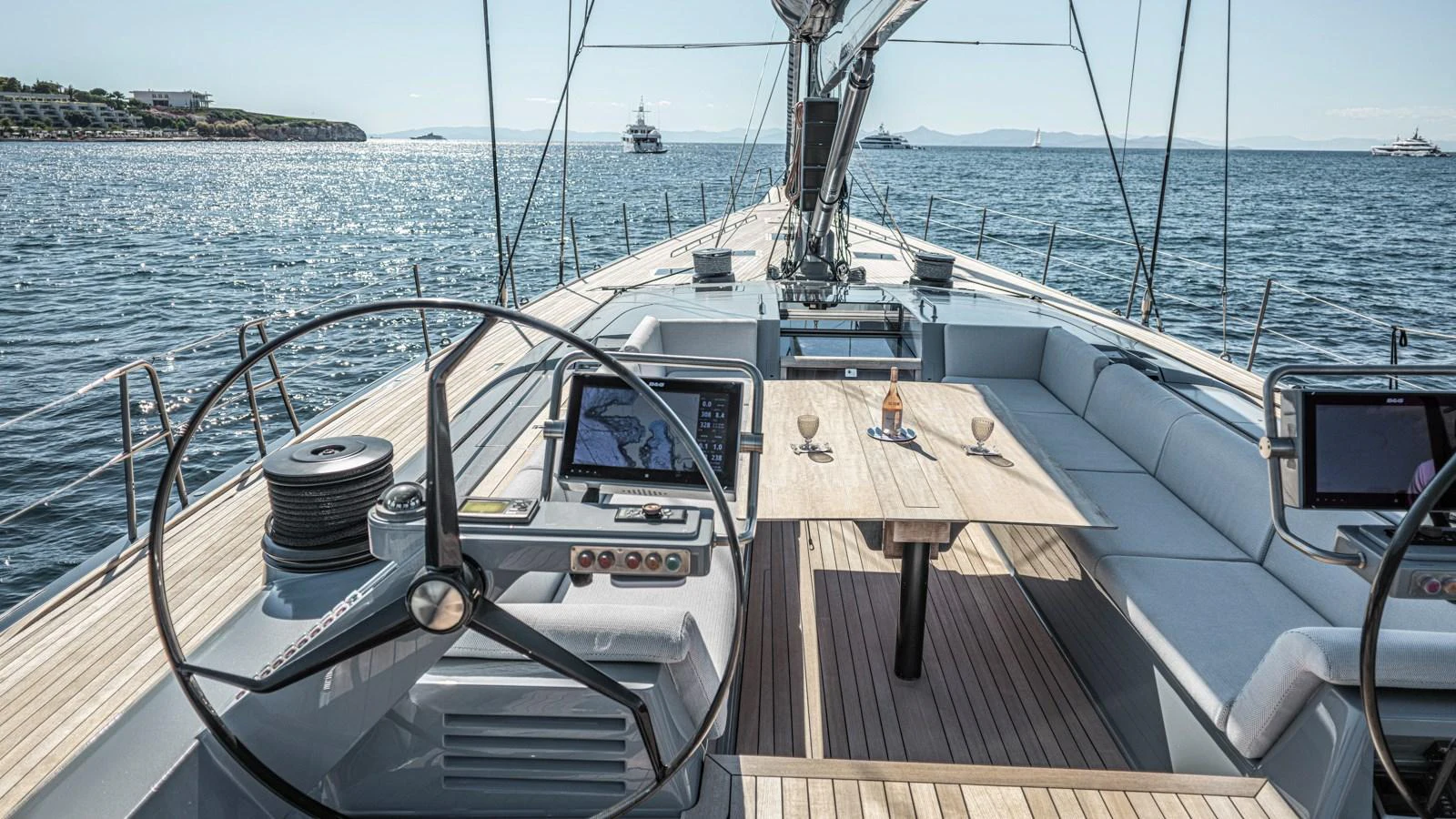 The yacht's cockpit offers a spacious and luxurious area for navigation and relaxation, featuring modern steering wheels and comfortable seating. aboard AUGUSTA WALLY Yacht for Sale
