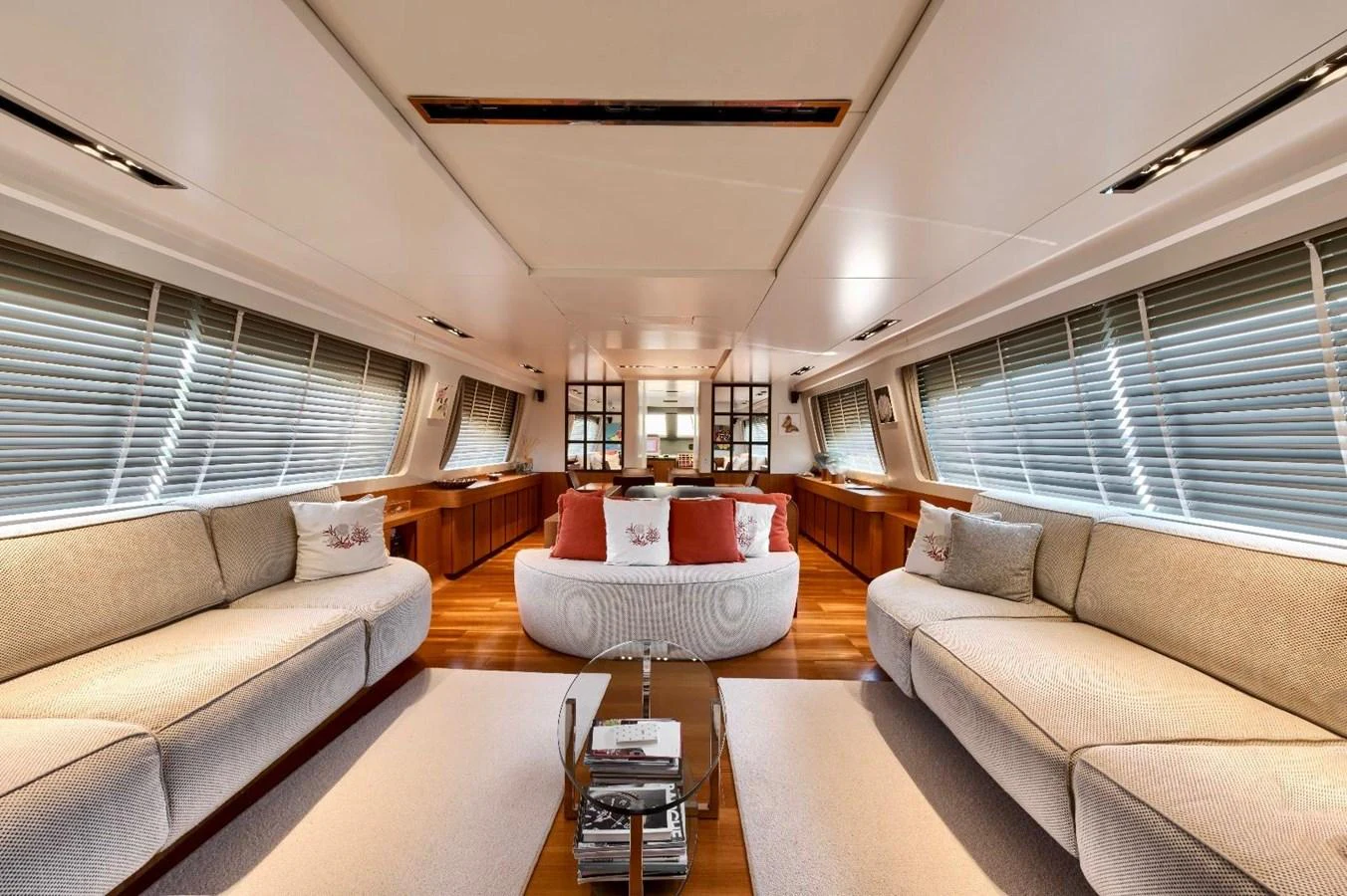 The salon features plush seating, elegant decor, and ample natural light, creating a welcoming and luxurious atmosphere. aboard MARIPOSA Yacht for Sale