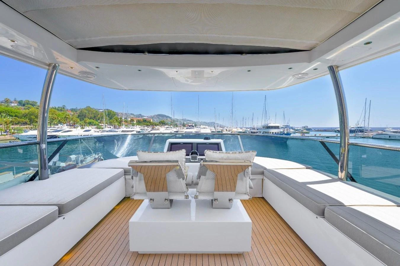 The flybridge offers a spacious and luxurious seating area with panoramic views of the marina. aboard MARIPOSA Yacht for Sale