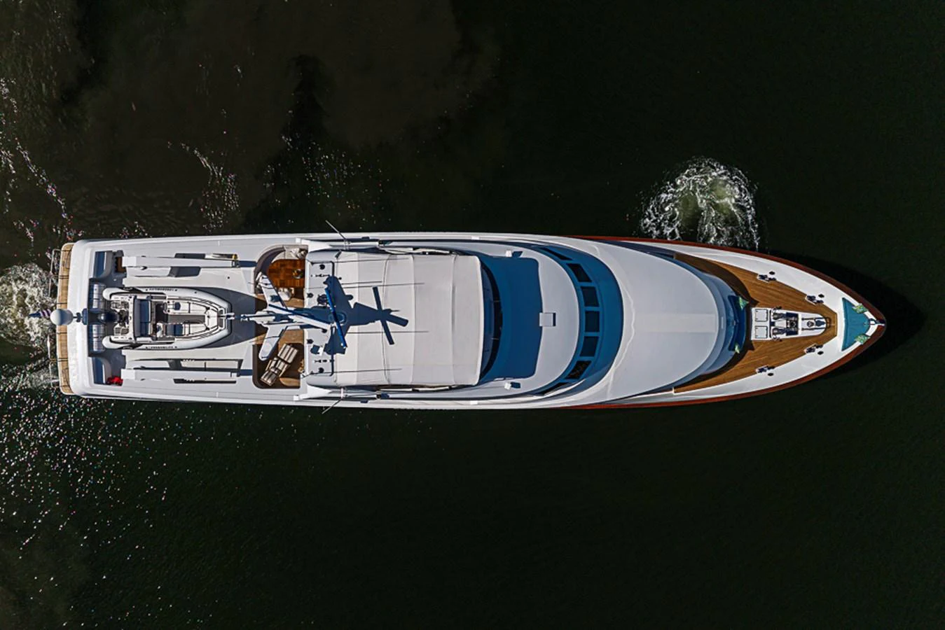 Aerial view of a sleek yacht cruising through dark waters. aboard PROBABILITY Yacht for Sale