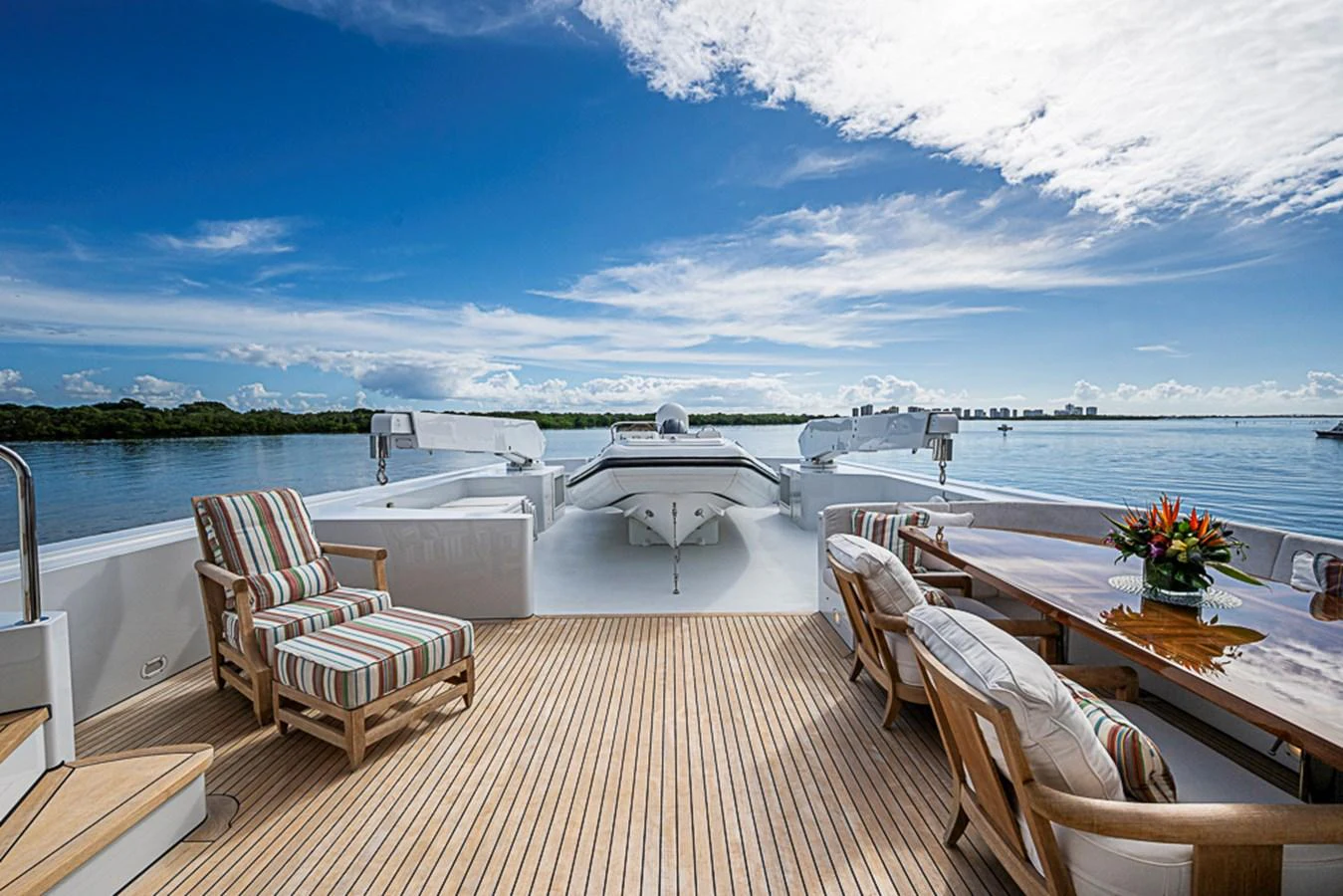 The aft deck offers a spacious and inviting area with comfortable seating and a beautiful view of the water. aboard PROBABILITY Yacht for Sale