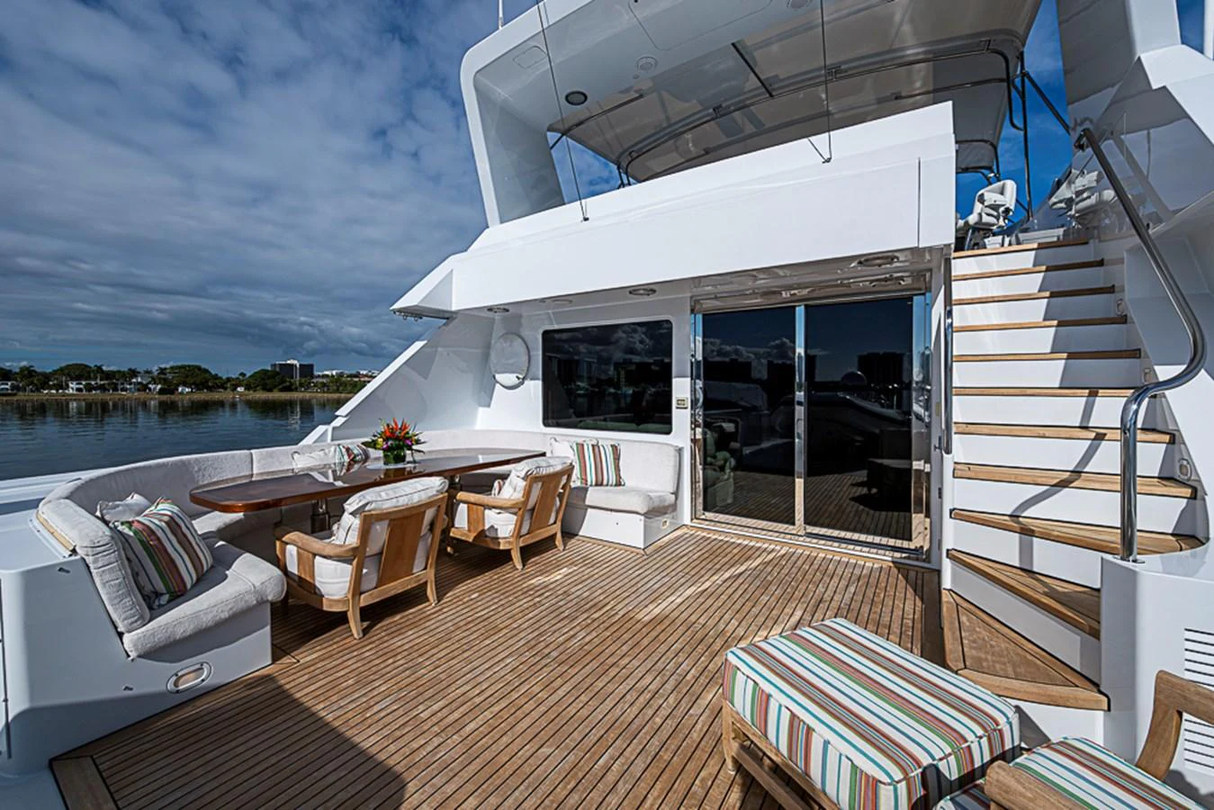 The aft deck offers a spacious and inviting outdoor seating area with comfortable furnishings and a beautiful view. aboard PROBABILITY Yacht for Sale